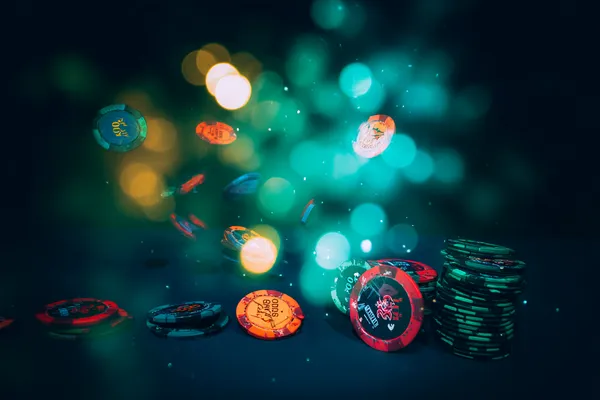 A professional dealer in a tuxedo greeting players at the roulette table, symbolizing the authentic live casino feel at PK66.