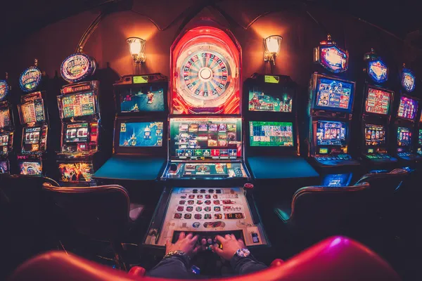 A close-up shot of golden coins falling around a spinning roulette wheel, representing immersive casino action at PK66.