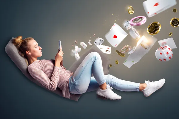 PK66 Mobile Casino — Play anytime, anywhere A player using their smartphone during a festive local event, representing PK66’s fully mobile-friendly casino.